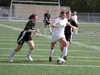 Wasilla senior Alexis Abbott splits the defense before firing a shot on goal during an 8-0 win over Nikiski in the Northern Lights Conference quarterfinals May 21 at Colony High School in Pal