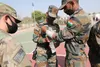 U.S. medics from 2-3 Infantry Battalion, 1-2 Stryker Brigade Combat Team demonstrate life-saving techniques with soldiers of the Indian Army's 11th Jammu And Kashmir (JAK) Rifles Battalion, F