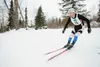 Former Palmer High cross-county skiing coach Darin Markwardt speeds around a corner during Friday’s Solstice Sprints on the trails at the new Government Peak Recreation Area. ROBERT DeBERRY/F