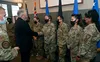 Secretary of the Air Force Frank Kendall hands out coins to Airmen after having a meeting with them at Joint Base Pearl Harbor-Hickam, Hawaii, August 17, 2021. Kendall visited the base to mee