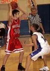 Adam Fitt-Chappell, left, of Wasilla looks for an open player
with Palmer's Zac Forsyth defending in the fourth quarter of
Tuesday's game at Palmer High School. Photo by TIM
BRODT/Frontiersma