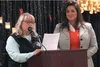 Emcee Cheryl Metiva introduces keynote speaker Michelle Overstreet.