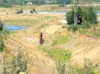 Courtesy Mat-Su Borough An impoundment weir was unsuccessful in
controlling water flowing from dredge ponds in south Palmer.