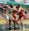 Colony's Emma Hopkins and Wasilla's Sierra Baird battle for the basketball during Colony's 50-39 win Friday. Courtesy of Bruce Eggleston/matsusports.net
