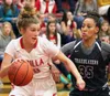 Wasilla junior Azlynn Brandenburg tries to drive the baseline during a loss to Sierra Canyon of Chatsforth, California, in the girls' championship game of the 2016 Doc Larson Roundball Classi