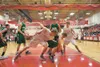 Wasilla's Connor Devine and Colony's Jared Turner scramble to gain possession of the ball during the first period of Saturday's championship game at Wasilla High School. Robert DeBerry