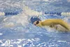 Palmer Moose Noelle Graham grabs a breath of air as she competes in the girls 400-yard freestyle relay at the Colony Relays swim meet in Palmer. Robert DeBerry