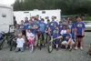 Participants in the 4.5-mile family run portion of the Alaska State Troopers Adventure Relay pose for a photo Saturday. The relay entails biking, hiking, rafting, and even a single one-mile s