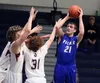 Palmer senior Liam Hughes-Duffy tries to drop in the putback during a 47-45 win over Juneau-Douglas Saturday at Palmer High. Jeremiah Bartz/Frontiersman