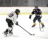 Houston's Memphis Elliott skates the puck up the ice during a win over Tri Valley. Bruce Eggleston/matsusports.net
