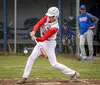 Wasilla's Oscar Savala turns on a pitch during a win over Palmer. Courtesy of Bryan Boyett