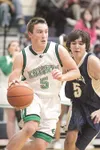 Colony senior guard Jaron Murphy drives past Homer Mariner
Gordon Parker during Thursday's Northern Lights Conference
Chaampionship match up at Palmer High School. (ROBERT
DeBERRY/Frontiersma