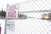 ROBERT DeBERRY/Frontiersman A female student at Meadow Lakes
Elementary School, pictured in this photo taken Thursday from the
locked gate along Pittman Road, was suspended for allegedly writ