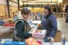 Special Santa assistant Chief Elf Brenda Arney helps volunteer
Diana Roberts choose Christmas presents for a Special Santa
recipient Saturday at the Special Santa Warehouse in Wasilla.
(ROBER