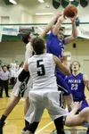 Palmer juinor Jared Hawkins battles a pair of Colony Knights for the basketball during a loss to the Knights Tuesday at Colony High. Courtesy of Bruce Eggleston/matsusports.net