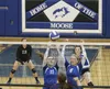 Palmer's Ellen Groseclose and Mariah McNamara reach for the block during a 3-2 win over Soldotna Oct. 11 at Palmer HIgh School. Jeremiah Bartz/Frontiersman