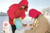 (ROBERT DeBERRY/Frontiersman) Kathy Zeitz and Chelsey Lord work
on part of an ice sculpture Saturday during the Colony Christmas
celebration in Palmer.