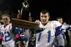Nick Benshetler, seen here hoisting the Mayor's Cup after a win in the Potato Bowl in 2013, signed his National Letter of Intent to play for the University of Mary. Benshetler was a three-yea