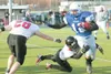 ROBERT DeBERRY/Frontiersman Palmer Moose Rick Lechiminant breaks
past two Juneau defensmen for a first down during the 2007 ASAA
First National Bowl State Championship Saturday at the Anchora