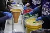 Students attending the April statewide convention of Future Farmers of America in Palmer work to fulfill their annual service project by packing 50,000 dry meals for distribution around the s