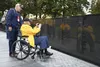 Peter Jones, a retired U.S. Army Soldier from Mount Pleasant, Iowa, and Michael Downey, a tour group volunteer, view the Vietnam Veterans Memorial in Washington Nov. 4, 2021. Jones, who serve