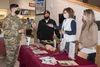 A U.S. Army soldier receives a pamphlet on nutritional food choices during the 'Ask the Registered Dietitian' Nutrition and Taste Testing event at Joint Base Elmendorf-Richardson, Alaska, Sep