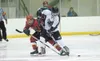 Colony’s Kevin Hartley takes control of the puck during Friday’s
game against the West Valley Wolfpack at the Curtis C. Menard II
Memorial Ice Arena in Wasilla. ROBERT DeBERRY/Frontiersman Ro