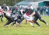 ROBERT DeBERRY/Frontiersman Colony defenders Cache Summers and
Caleb Monson take down Juneau’s Chris Holloway Friday at Colony
High School.
