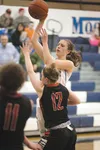 Palmer sophomore Carly Venzke lifts a shot during the first half of a 32-30 win over Kenai on Friday. Venzke supplied the go-ahead basket for Palmer in the fourth quarter. ROBERT DeBERRY/Fron