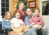 The Sullivan family, from left, wife Julie, Madeline, 7, Molly, 12, Anne, 9, and dad Brian sit for a family portrait in their Wasilla home. Also pictured is the family’s cat, Rocky. Brian Sul