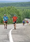 Sam Crow and Jason Walsh run together up the first long hill during Saturday’s Hatcher Pass Marathon. Walsh placed second among the men, while Crow finished fifth. Courtesy Clark Fair