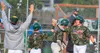 Mat-Su's Cole Funkhouser high-fives Carter Geffre during a recent win. The Miners clinched home field advantage in the Alaska Baseball League Top of the World Series, which starts Monday, Jul