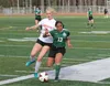 Wasilla's Briann Drorbaugh battles with Colony's Stirling Elliott for the ball during a 1-0 win over the Knights Monday at Wasilla High School. JEREMIAH BARTZ/ Frontiersman