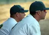 Mike Buchmiller, left, and Jimmy Smith, right, look on as the
Mat-Su Miners clinch the Alaska Baseball League title in a win over
the Alaska Goldpanners in the final game of the regular seaso