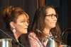 Sarah Palin speaks and Mary Peltola listens at a March 12 forum of candidates for the U.S. House seat left vacant by the death of Don Young.  Yereth Rosen/Alaska Beacon