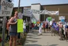 Both supporters of Gov. Mike Dunleavy and protesters rallied at Wasilla Middle School Monday. Jacob Mann/Frontiersman