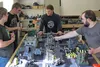 Clockwise from left, Jonathan Biggerstaff, Kyle Talcott, Jonathan Raynovic and Keenan Croy play a version of the Warhammer fantasy game at MJ's Cards and Comics in Wasilla on Wednesday, June 
