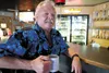 Tailgaters owner Ted Anderson sits inside the now smoke-free bar along the Parks Highway. ROBERT DeBERRY/Frontiersman.com