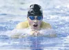 ROBERT DeBERRY/Frontiersman Colony’s Zane Mileur takes a breath
as he breaks the surface during the boys 200-yard individual medley
Saturday at the 2009 Valley Invitational.