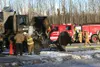 A charred Alaska Department of Transportation plow truck on
Monday afternoon sits on the Palmer-Wasilla Highway. Photo by BOB
MARTINSON/Frontiersman