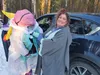 Houston Parks and Recreation Commissioner Kimberly Mietzah Damkoehler helps her daughter Brandy Adamns put on her inflatable unicorn costume at the Houston Trunk or Treat event on Halloween i