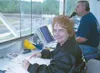 Nancy Wallace counts laps at Capitol Speedway while Thom Conway
announces. Wallace and husband Wes have owned and operated the
track for 26 years. Conway and wife, Linda, are sharing in some 