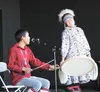 Byron Nicholai performs Yup'ik songs with dancer Deanna Jimmie during Saturday's Performance at the Dena' People's Stage at the Alaska State Fair in Palmer. MATT HICKMAN/Frontiersman