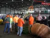 Dale Marshall hugs his friend after beating the Alaska State Fair record with his 2,051 pound pumpkin. Jacob Mann/Frontiersman