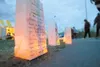 ROBERT DeBERRY/Frontiersman Bags with messages to loved ones
past and present line the track at Colony High School during the
Relay For Life event Friday.