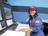 Photo courtesy Michelle Boyden Michelle Boyden sits at the
CAPCOM mission control seat during an Atlantis mission simulation
at the Honeywell Space Academy.