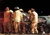 ROBERT DeBERRY/Frontiersman Responders from the Central Mat-Su
Fire Department move Erin L. Kruse, 50, of Houston from a 1995
black Jeep Grand Cherokee to a waiting ambulance Saturday at the

