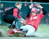 Houston catcher Larry Kincaid lays the tag on Wasilla's Ben
Fauske during the sixth inning of the Warriors' 4-1 win over the
Hawks at Carl Fritzler Field on Tuesday.WILLIAM WOODY/
Frontiersma