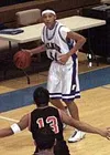 Stan Ratcliff sets up on offense for Palmer as Houston's Eleazar
Torino defends the perimeter. Photo by TIM BRODT/Frontiersman.