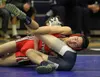 Houston's Jens Knutson works to control Redington's Jordan Morganflash during the 120-pound match of a dual last month at Palmer High School. Knutson scored a 20-7 major decision win over Mor